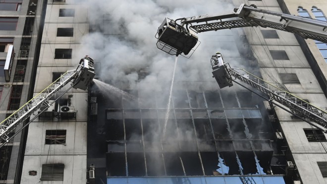 Workers jump to their death as office fire kills Seven