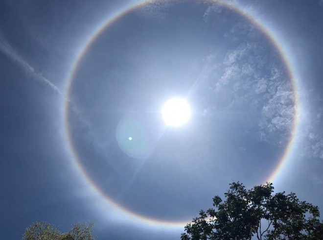 People witnessed a rare 22 degree halo around the sun